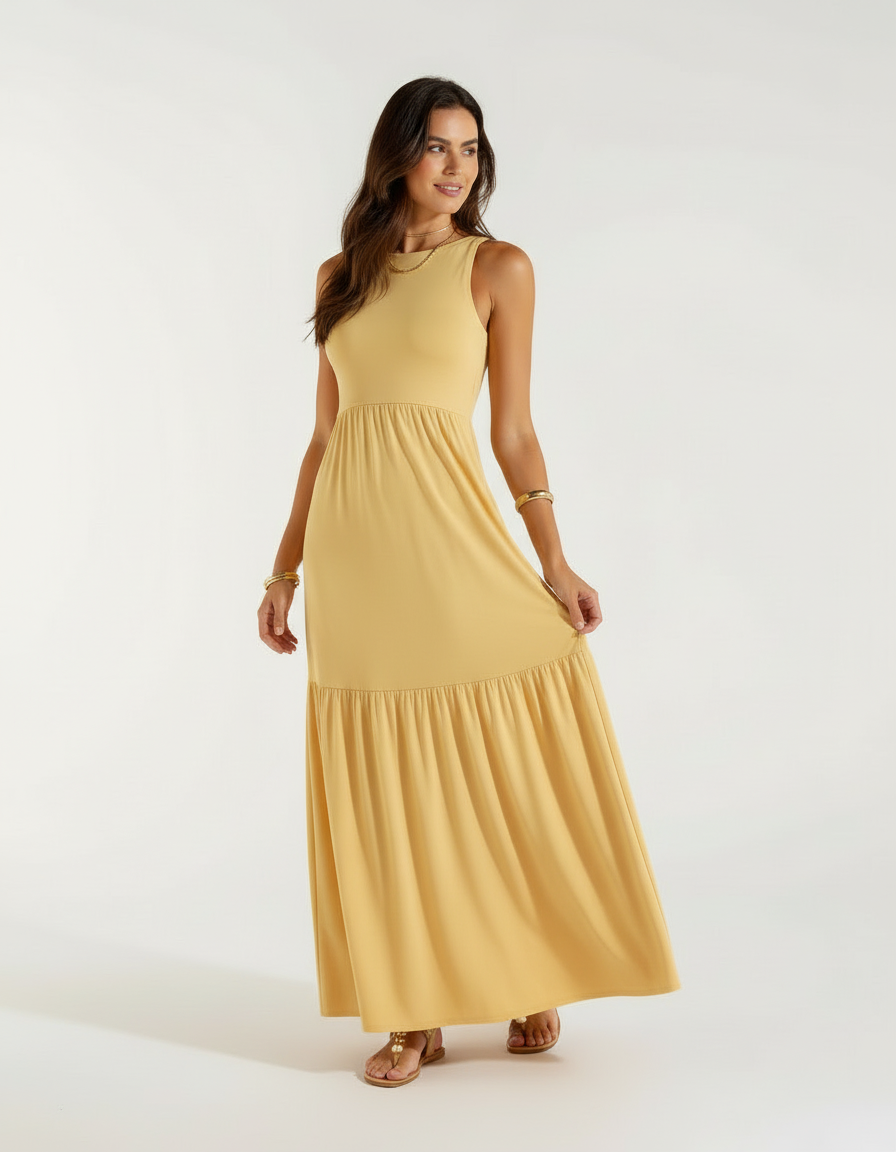 Mulher de lado com vestido longo amarelo mostarda com saia rodada e sandália bege